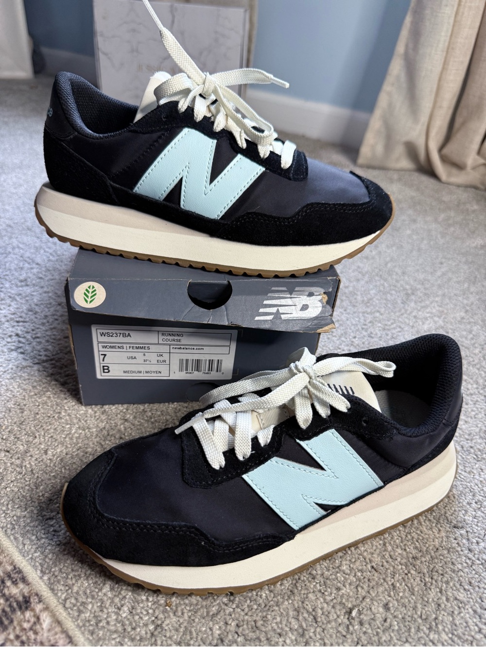 New Balance Women’s blue/black Sneakers with Light Blue N Logo